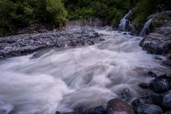 rushing blue river in a mountain forest. Mountain landscape. North Caucasus