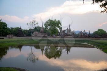 Sunset at Wat Mahatat in Sukhothai. A UNESCO world heritage site in Thailand. In the past, Sukhothai was Thailand's capital is thriving. The central government, religion and economy.