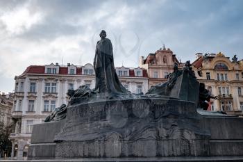 Prague, Czech Republic - 11.08.2019, Jan Hus monument at Old Town Square is the heart of the Czech city of Prague with many churches, old houses, a town hall and Prague chimes