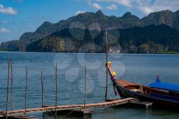 Wooden longtail boat in province Krabi, Thailand. Travel by Asia. Landscape with traditional fishing boat