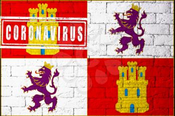 Flag of the regions or communities of Spain Castilla Leon with original proportions. stamped of Coronavirus. brick wall texture. Corona virus concept. On the verge of a COVID-19 or 2019-nCoV Pandemic