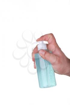male hand holding a bottle with blue sanitizer isolated in white background. concept of Prevention of diseases. Covid-19.