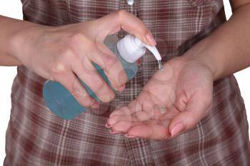 woman hands using wash hand sanitizer gel pump dispenser, A woman using hand cream. Washing hand with Alcohol Sanitizer, prevent the virus and bacterias, Hygiene concept.