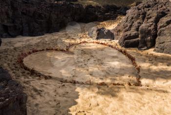 Love symbol in shape of a heart dug into the sand of Kauai beach