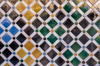 Detail of diamond shaped antique arabic tiles in palace in Alhambra in Granada Spain