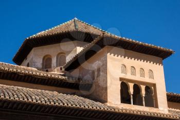 Ornate roof and windows above Nasrid palace in Alhambra Granada, Spain