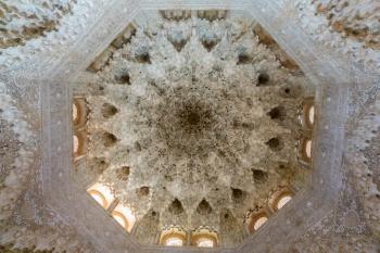 Highly ornate and complex carvings on ceiling of Nasrid palace of Alhambra in Granada Spain