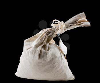 Isolated cutout image of a cloth bullion, cash or money bag filled with coins and tied at the nexk. Black background with path in file