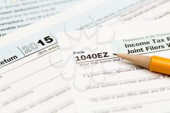 USA IRS tax form 1040EZ for year 2015 with pencil and taken from above