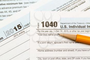 USA IRS tax form 1040 for year 2015 with pencil and taken from above