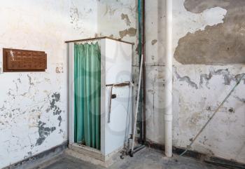Shower stall and curtain inside Trans-Allegheny Lunatic Asylum in Weston, West Virginia, USA