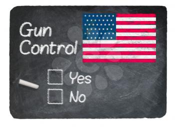 Gun Control voting choice message written on a chalky natural slate blackboard with yes no checkbox and chalk