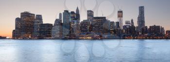 Lower Manhattan at sunset taken from side of Brooklyn Bridge. Sized to fit a popular social media cover image placeholder
