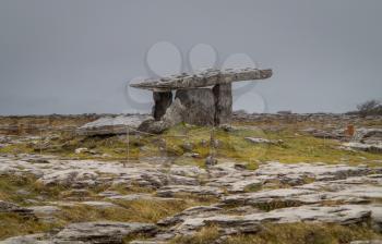 Poulnabrone Dolmen burial chamber near Burren in Eire on a grey cloudy day