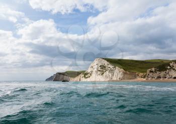 Jurassic Coast cliffs and headland taken from a boat at sea at West Bay in Dorset. This was used as the location for the Broadchurch TV series