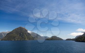 Sailing into Doubtful Sound on South Island of New Zealand aboard a cruise ship showing strong headwinds coming towards the ship