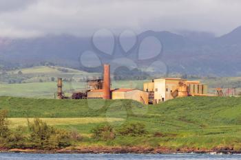 Old sugar mill or factory now abandoned on the coast of Kauai in Hawaii