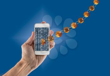 Set of gold bitcoins linked by chain on blue background and emerging from app on smartphone to illustrate concept of blockchain for mobile money payments
