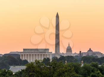 Dawn and sunrise over nations capital with all monuments aligned against orange sky