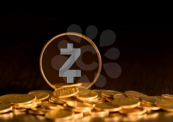 Illustration of Zcash coin on gold background to illustrate blockchain and cyber currency