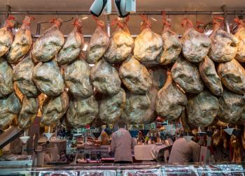 VALENCIA, SPAIN - MARCH 16, 2018: Iberian hams for sale in main market in Valencia, Spain