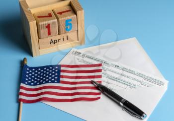 New Form 1040 Simplified for 2018 in envelope allows for filing on April 15, tax day, on a postcard