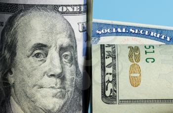 Social Security trust fund problem with roll of USA dollar bills with focus on the face of Benjamin Franklin on 100 dollar note