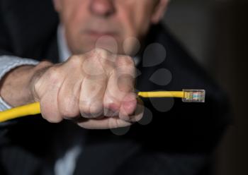 Senior caucasian businessman choking or slowing streaming data in illustration of net neutrality regulations