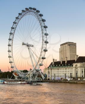 LLONDON, UK - OCTOBER 1, 2015: ondon Eye or Millenium Wheel on South Bank of River Thames in London England
