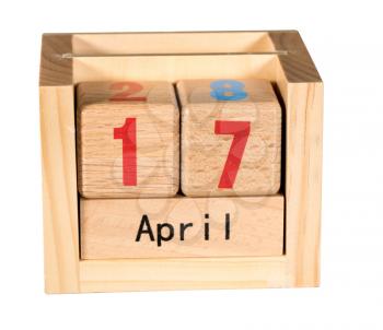 Wooden letters in isolated calendar showing tax day for filing is April 17 2018