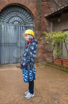 Senior female tourist waiting by the entrance to the Domus Aurea excavation site in Rome