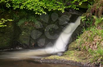 Small cascade at foot of waterfall of Pistyll Rhaeadr falls in Wales