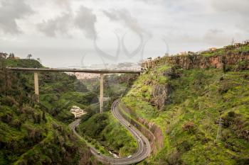 Modern bridge across gorge in the mountainside above Funchal in Madiera
