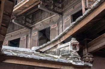Traditional chinese carvings on roof at Tulou at Unesco heritage site near Xiamen