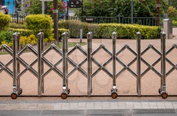 Stainless steel expandable metal fence or barrier across a street in China