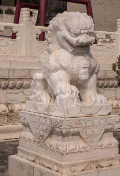 Large marble lion statue at entrance to Giant Wild Goose Pagoda in Xi'an