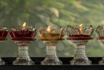 Colorful votive candles in glass dishes at Giant Wild Goose Pagoda in Xi'an
