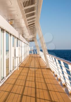 Walkway around the deck of a modern luxury cruise ship at sea