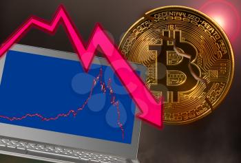 Concept of bitcoin or cyber currency price crash with laptop with falling price graph