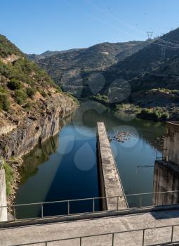 Solid structure of the Valeira dam on River Douro in Portugal looking down into the gorge