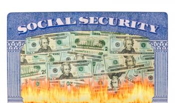 Concept of social security and retirement funding issues in USA with many US dollars on fire inside the framework of a social security card