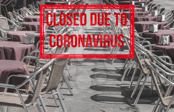 Empty tables and chairs of outdoor cafe in Plaza Mayor in Salamanca closed due to coronavirus