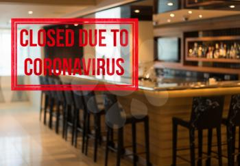 Defocused view of interior of an upmarket bar empty and closed due to coronavirus or covid-19
