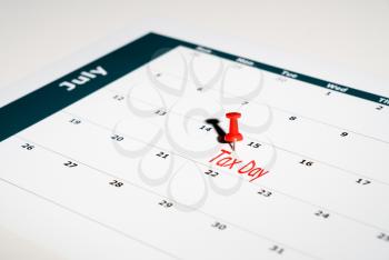 Reminder for sending income tax return for July 15 2020 tax day due to Covid-19 virus delay using calendar page and pin