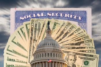 US Congress and Capitol in Washington DC with cash and social security card to illustrate budget problems as a result of coronavirus