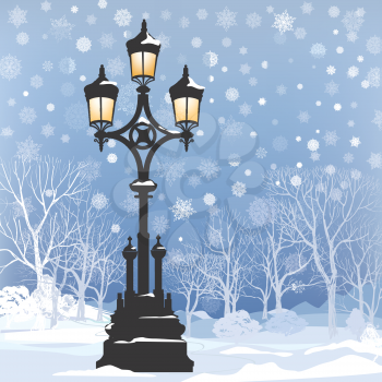 Christmas Winter Landscape with luminous street lantern, snow flakes and trees. Old street light in park snow alley.  
