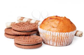 Chocolate cookies and muffin on a white background