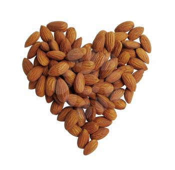 Peeled almonds closeup, heart shape background