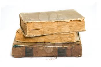 A stack of shabby old books on a white background