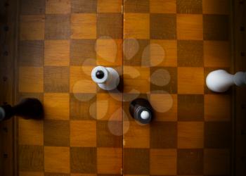 old chess on a chess classic wooden board on a dark background